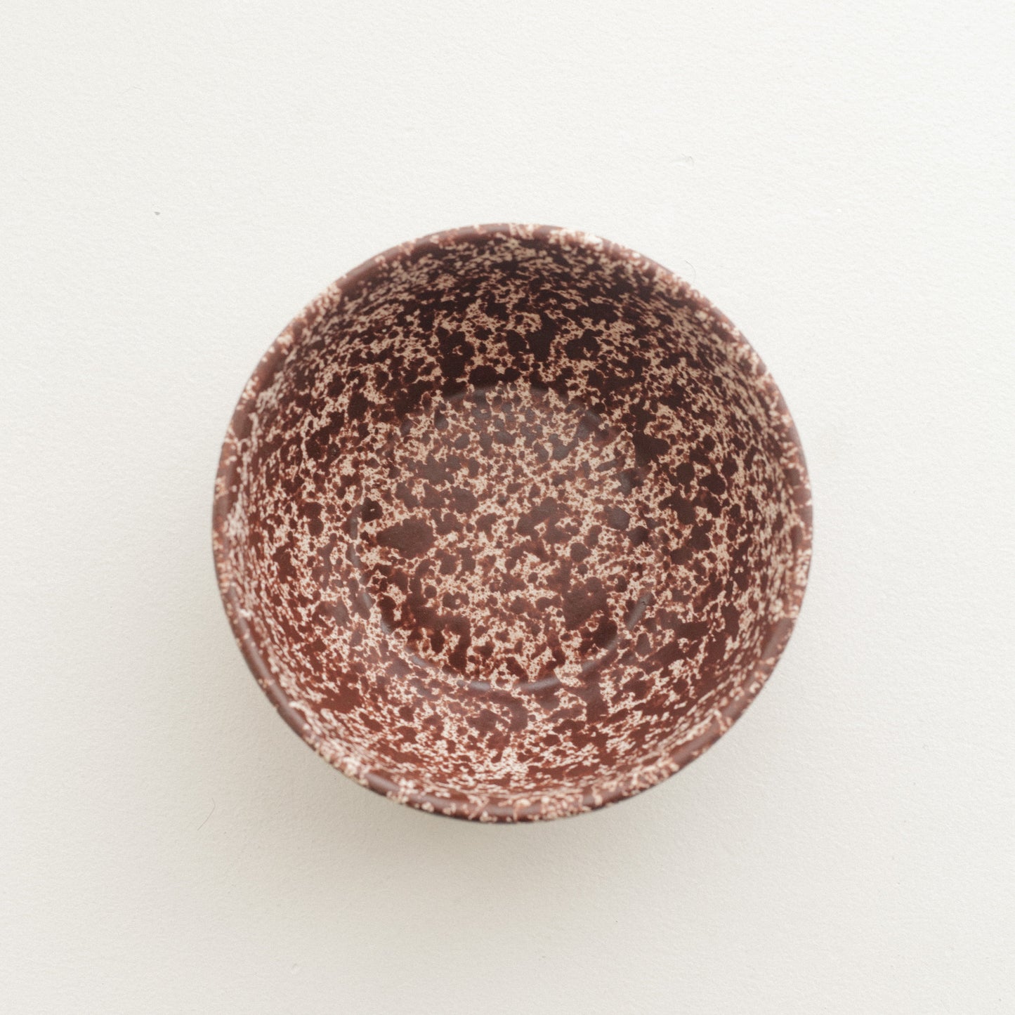 Cool Handmade Ceramic Bowl in white base with deep burgundy speckles.