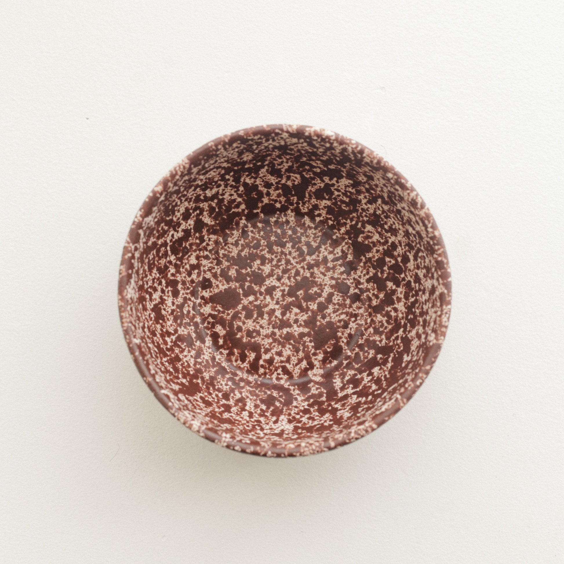 Cool Handmade Ceramic Bowl in white base with deep burgundy speckles.