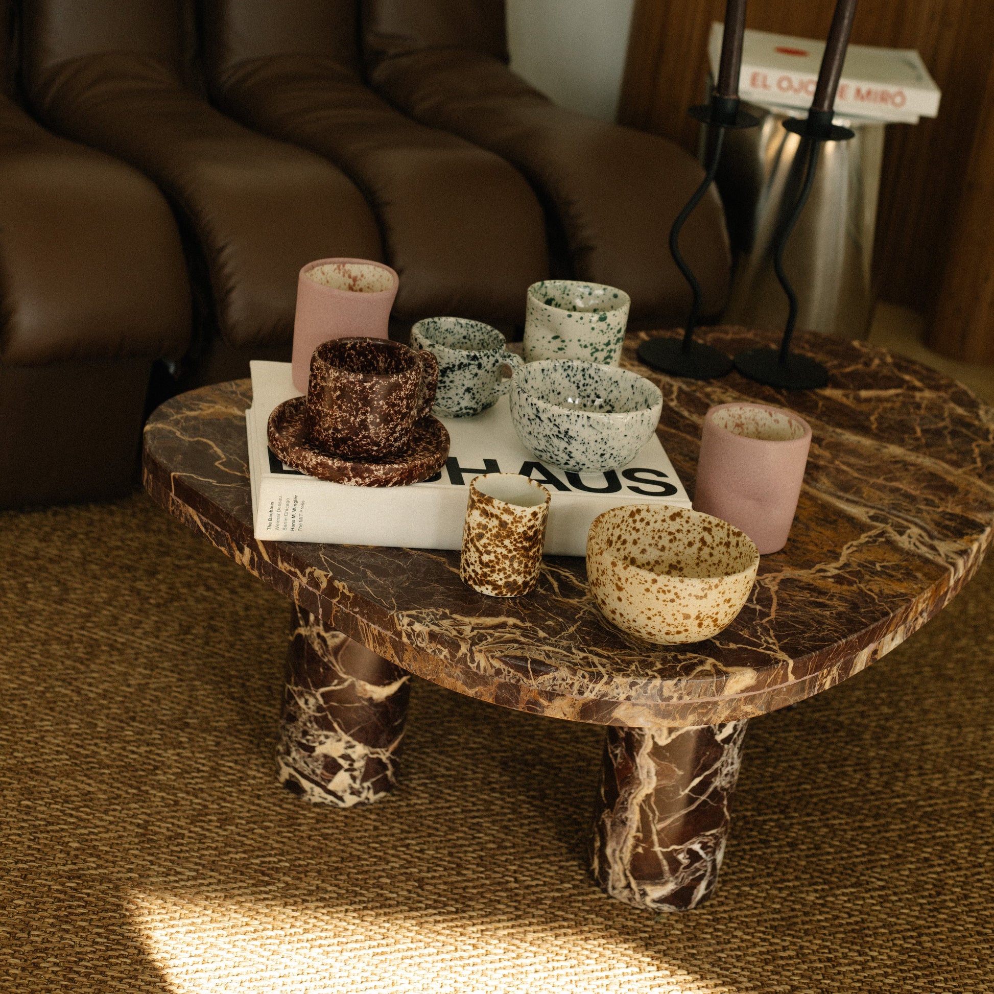 Coffee table with decorative items in a living room setting
